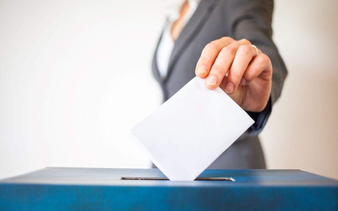 Hand putting in ballot paper